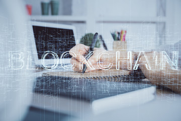Cryptocurrency hologram over hands taking notes background. Concept of blockchain. Multi exposure
