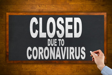 blackboard with text: closed due to Coronavirus