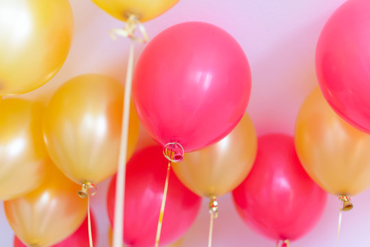 Red And Gold Balloons With Helium Under The Ceiling For A Birthday Party