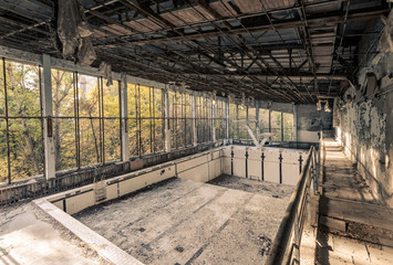 Abandoned empty swimming pool in school in Pripyat near Chernobyl in Ukraine