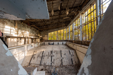 Abandoned empty swimming pool in school in Pripyat near Chernobyl in Ukraine