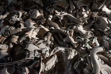 Gasmasks lying on tthe ground in abandoned school in Pripyat near Chernobyl in Ukraine