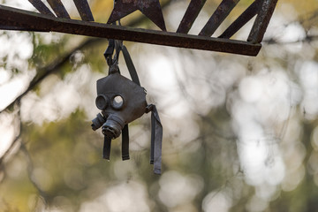 Gasmask hanging on street lamp in Pripyat near Chernobyl in Ukraine