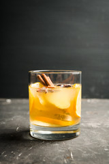 Healthy hot beverage with lemon, ginger and spices for protection in flu season. Selective focus. Shallow depth of field.