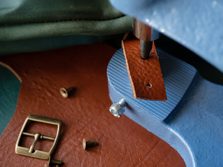 Genuine Leather. Sewing a purse. Leather work. Tools for sewing bags, wallets, clutches. Stitching....