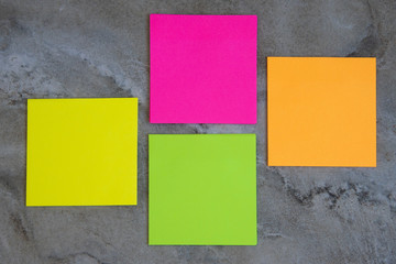 Colorful sticky notes on stone background Image