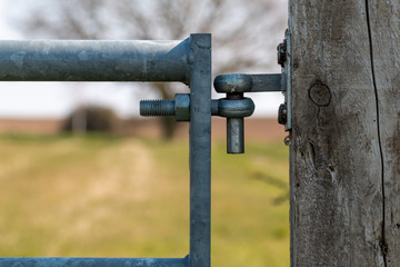 Gate hinged to wooden post