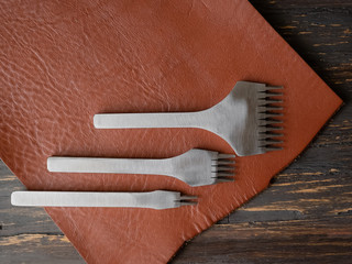 Genuine Leather. Sewing a purse. Leather work. Tools for sewing bags, wallets, clutches. Stitching....