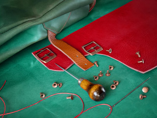 Genuine Leather. Sewing a purse. Leather work. Tools for sewing bags, wallets, clutches. Stitching....