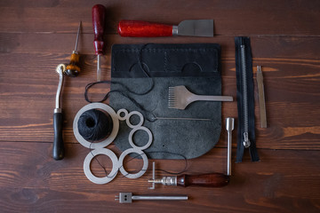 Genuine Leather. Sewing a purse. Leather work. Tools for sewing bags, wallets, clutches. Stitching....