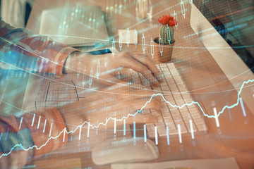 Double exposure of stock market chart with man working on computer on background. Concept of financial analysis.