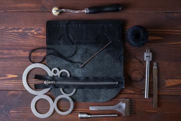 Genuine Leather. Sewing a purse. Leather work. Tools for sewing bags, wallets, clutches. Stitching....