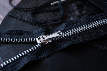 Genuine Leather. Sewing a purse. Leather work. Tools for sewing bags, wallets, clutches. Stitching. Manual sewing of the product. The manufacture of leather products.