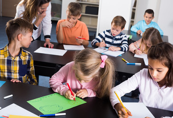 Professor and elementary age happy children