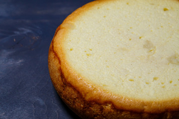 Freshly baked sponge cake with a golden brown crust.