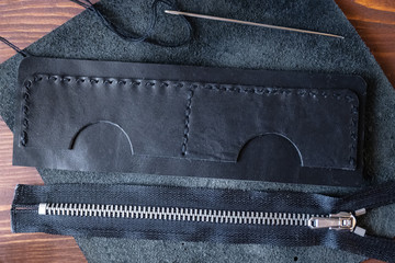 Genuine Leather. Sewing a purse. Leather work. Tools for sewing bags, wallets, clutches. Stitching....