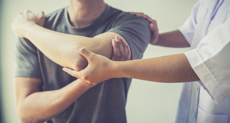 Professional therapists are stretching muscles, patients with abnormal muscular symptoms, physical rehabilitation therapies and treatment of physiological disorders by physiotherapists concept.