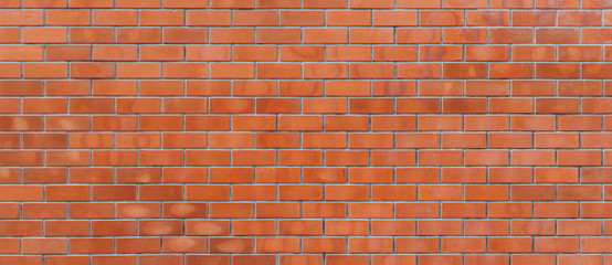 Panorama of red color brick wall for brickwork background design .