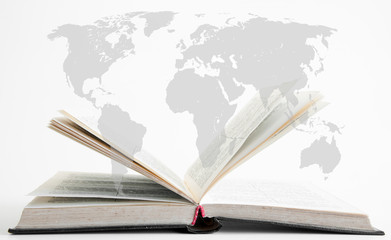 Open book. Against the background of a world map. Reading of books. Quarantined world.