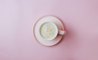 Coffee cup on pastel pink background. Minimal concept. Flat lay, top view