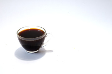 Black coffee in glass on white background. 