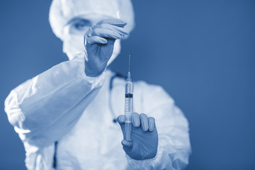 Syringe with medicine in good hands.