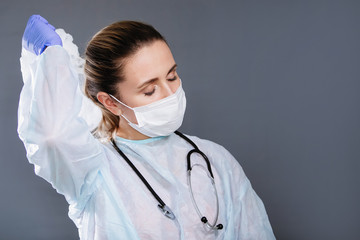 Nurse with phonendoscope, mask and cap.
