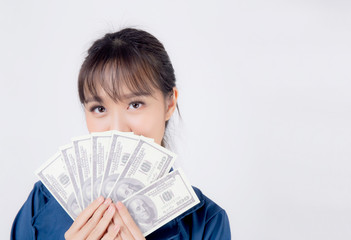 Beautiful portrait young business asian woman holding money isolated on white background, businesswoman showing banknotes with excited, happy girl income with profit finance and success concept.