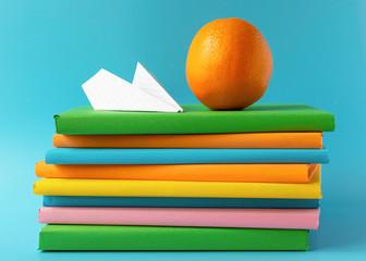 A stack of books, textbooks. Distance learning. Schoolboy is doing homework