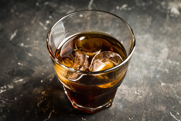 Black russian cocktail with ice and coffee liquor. Selective focus. Shallow depth of field.