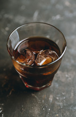 Black russian cocktail with ice and coffee liquor. Selective focus. Shallow depth of field.