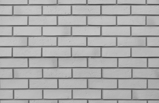 Fototapeta White brick wall. New smooth gray brick wall