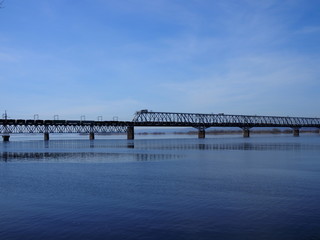 Railway bridge over the river. Sunny spring day.