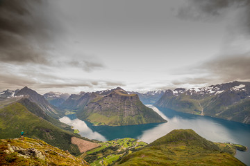 OYE, NORWAY 2016 AUGUST 04. Mountain Sakse view with Norwegian fjord and mountains. Below is Urke...