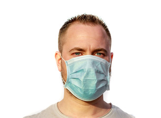 Man wearing mask and looking to camera on white background. Coronavirus concept. Health care and medical.