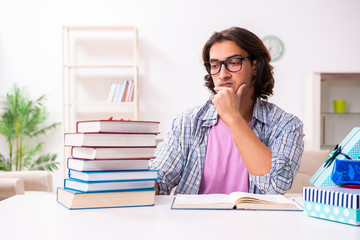 Young male student preparing for exams during Christmas