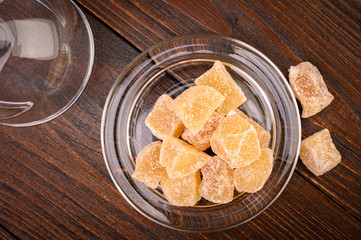 Candied ginger on a wooden table