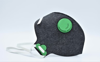 Protective facial half mask with breathing valve and FFP3 filter isolated on grey background....