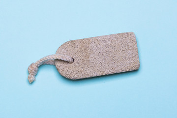 White pumice for cleaning feet on a blue background