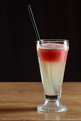 Fresh grapefruit juice in glass. Macro. Selective focus