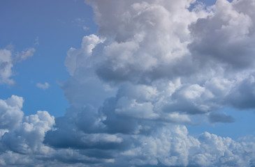 Naklejka na ściany i meble Beautiful cumulus clouds on a background of blue sky