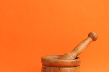 cooking wooden mortar in color background