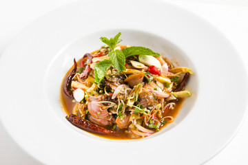 thai herb spicy clams salad serve in white plate