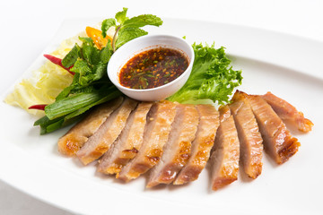 grilled pork eat with thai spicy salty sauce and vegetable