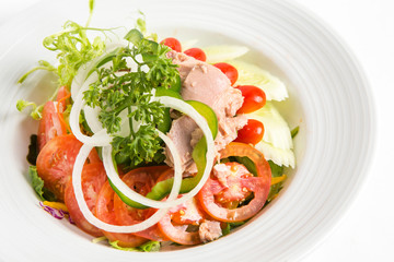 tuna salad in a white plate lots of vegetable and healthy food