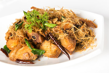 fired chicken with sliced lemon grass top with dry spicy red chili and coriander