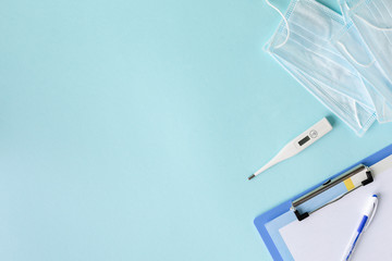medical concept on a blue background. stethoscope, pills, tablet, notepad, sheet of paper, pen....