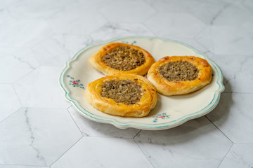 Kaytaz Pastry Pogaca with Minced Meat of Turkey Hatay Region in Plate.