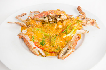 well arrangment stir fried crab curry crab yellow curry serve in white plate