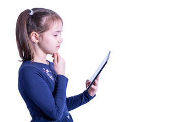 girl thoughtfully looks at the tablet